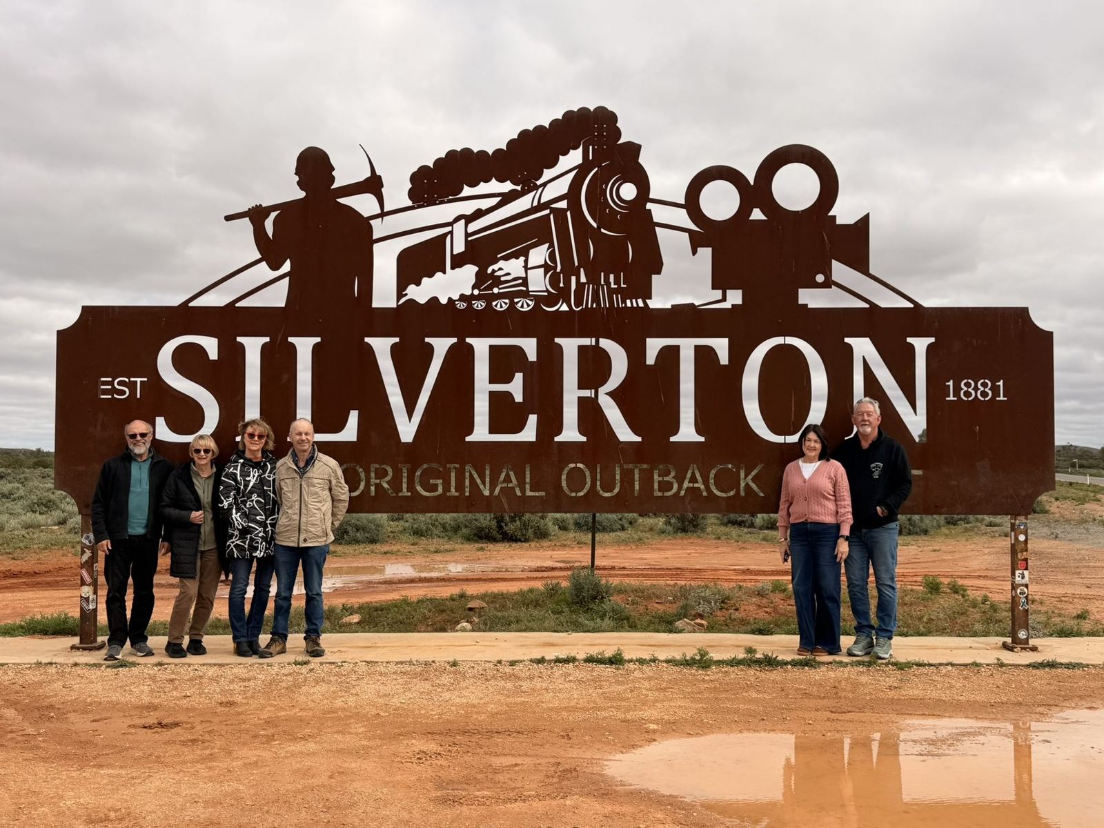 The rusty Silverton, The Original Outback sign with visitors beneath it