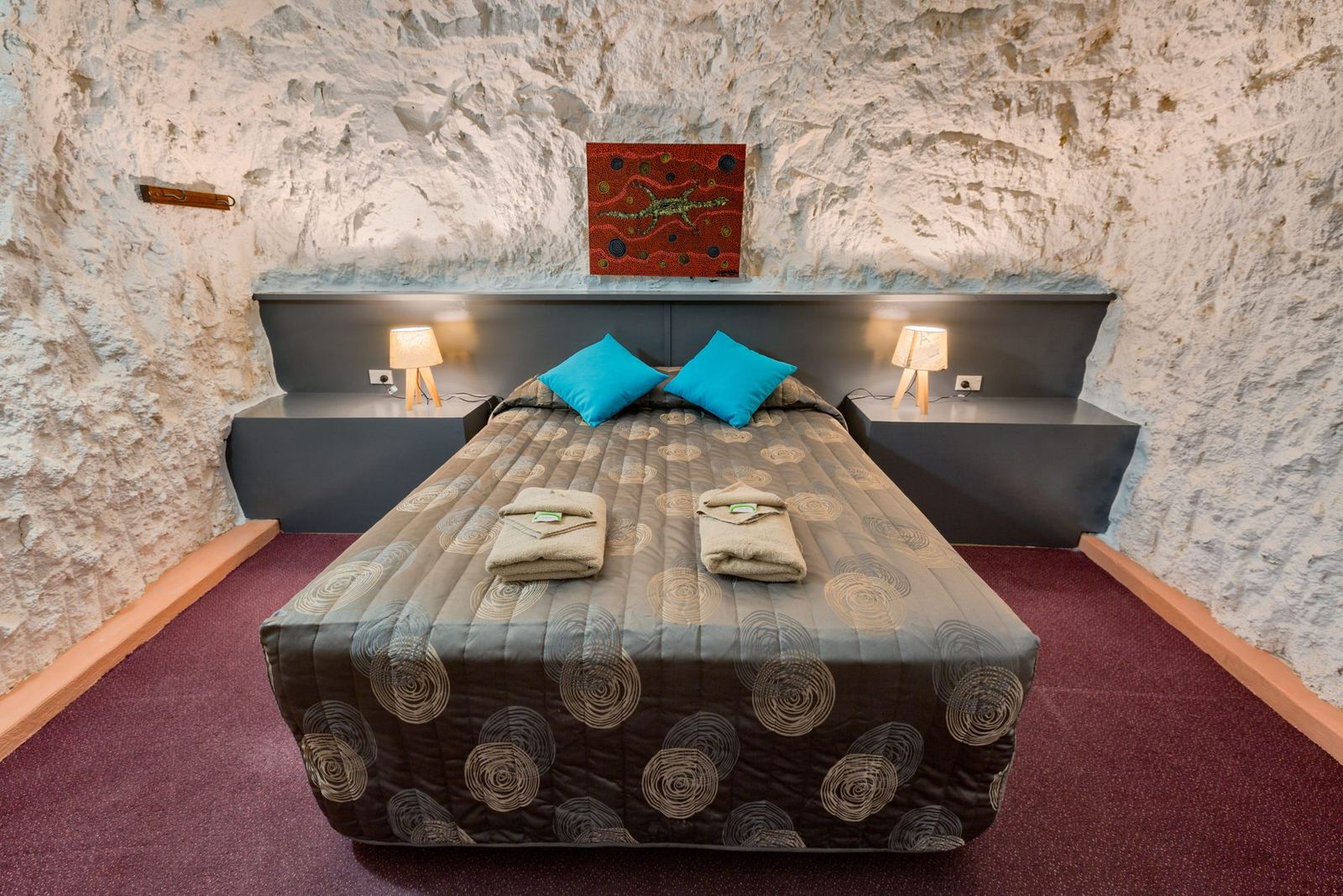An underground dugout bedroom carved into rock at White Cliffs